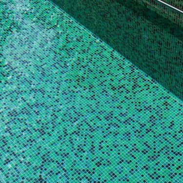 An emerald green swimming pool dream in a garden oasis with energy ...