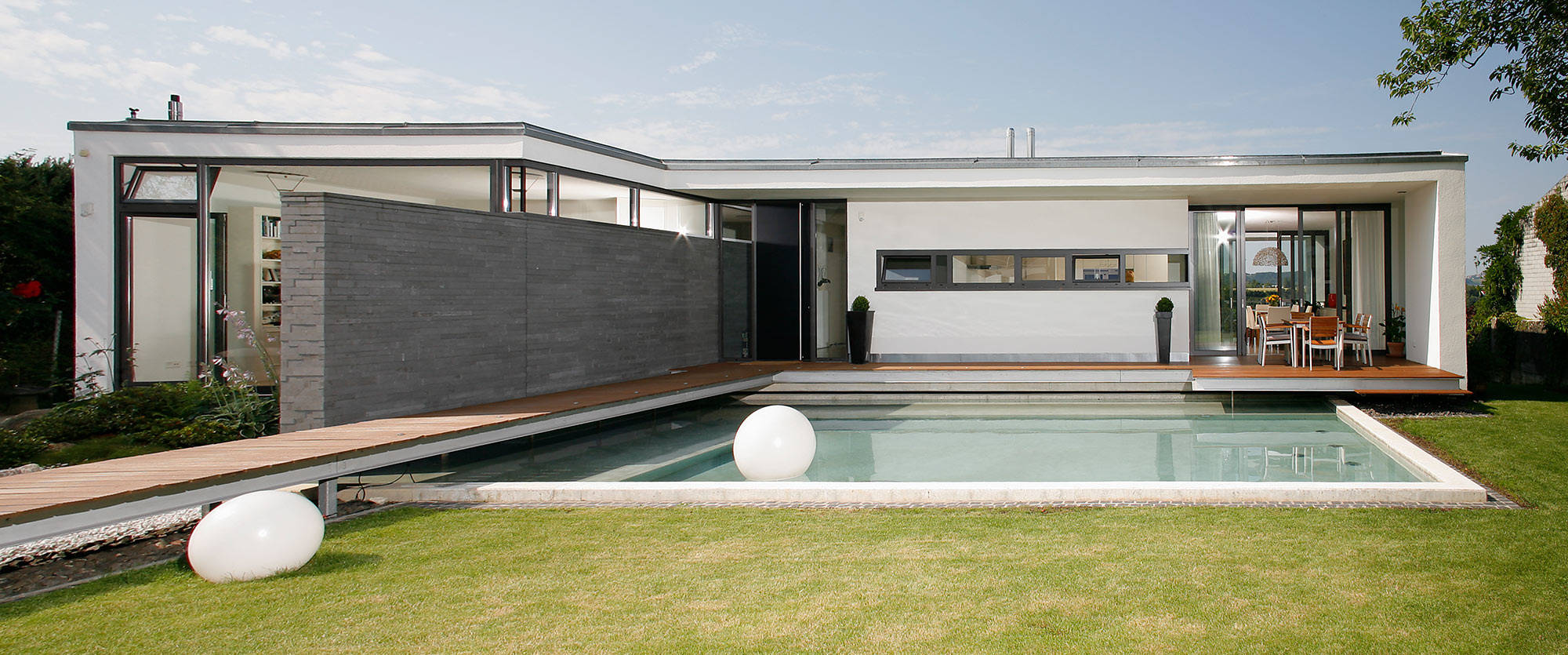 Outdoor pool in the back yard of a modern house