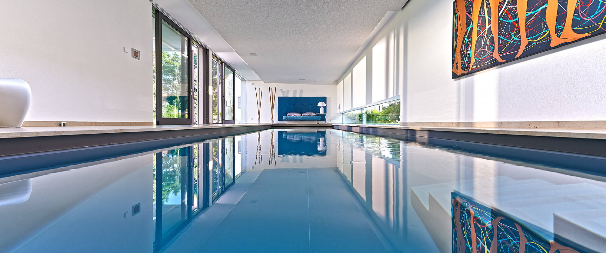 Indoor pool with view of the bed from the end