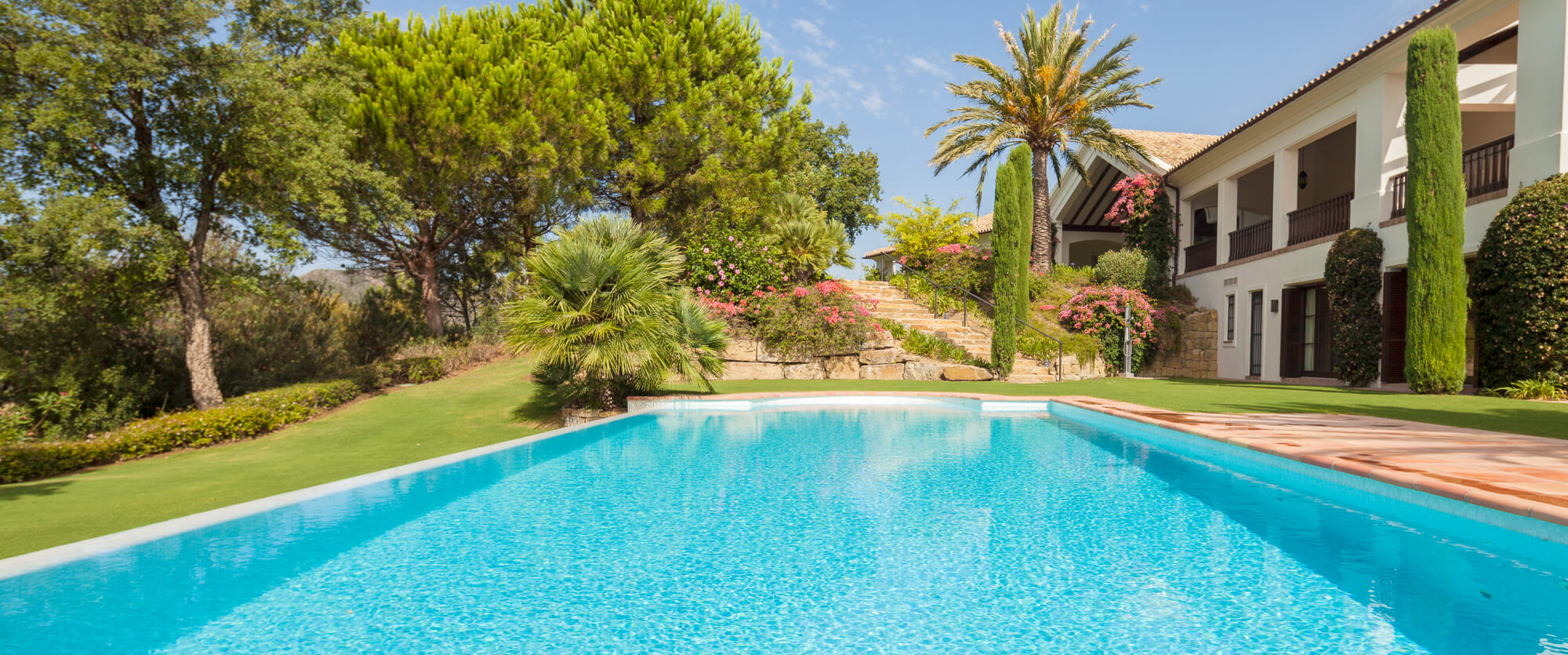 Outdoor pool with idyllic back yard